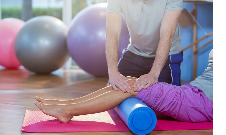 A person is using a foam roller to stretch.
